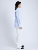 Side full length image of model wearing Allen Shirt in Crinkled Cotton Gabardine in SKY BLUE