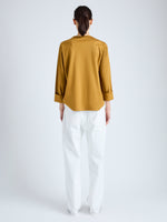 Back full length image of model wearing Olson T-Shirt in Eco Cotton Jersey in CIDER