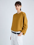 Detail image of model wearing Olson T-Shirt in Eco Cotton Jersey in CIDER