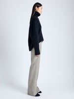 Side full length image of model wearing Aiden Pant in Melange Viscose Linen Suiting in BRONZE MULTI