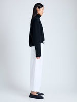 Side full length image of model wearing Amara Pant in Organic Cotton Twill Suiting in OFF WHITE