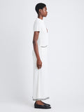 Side full length image of model wearing Auden Dress In Textured Knit in WHITE