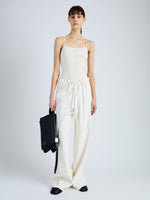 Front full length image of model wearing Serena Knit Bodysuit in Silk Viscose in IVORY