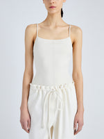 Detail image of model wearing Serena Knit Bodysuit in Silk Viscose in IVORY