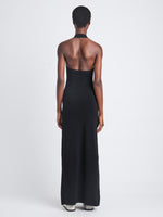 Back full length image of model wearing Meryl Dress In Matte Viscose Crepe Knit in BLACK