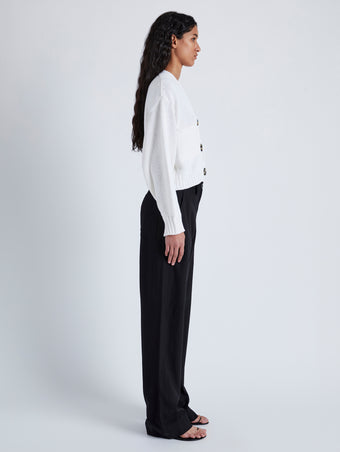 Side image of model wearing Sofia Cardigan In Cotton in OFF WHITE