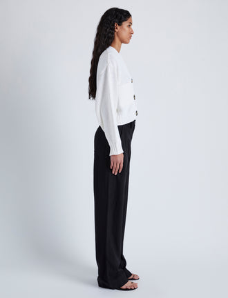 Side image of model wearing Sofia Cardigan In Cotton in OFF WHITE