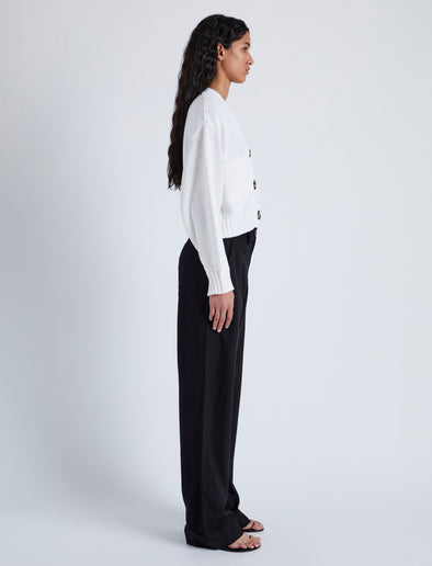 Side image of model wearing Sofia Cardigan In Cotton in OFF WHITE