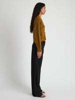 Side image of model wearing Sofia Cardigan In Cotton in OCHRE