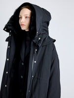 Proenza Schouler detail image of model wearing Wilder Coat in Stretch Nylon with Shearling Lining in black