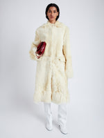 Front full length image of model wearing Fiona Coat In Sheared Toscana in Resin