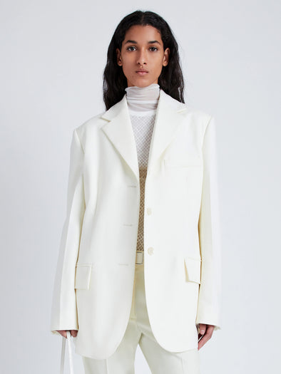 Proenza Schouler Front cropped image of model wearing Archer Jacket in Wool Twill Suiting in WAX