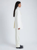 Proenza Schouler Side full length image of model wearing Archer Jacket in Wool Twill Suiting in WAX