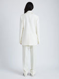 Proenza Schouler Back full length image of model wearing Archer Jacket in Wool Twill Suiting in WAX