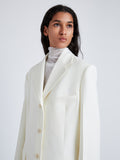 Proenza Schouler Detail image of model wearing Archer Jacket in Wool Twill Suiting in WAX