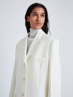 Proenza Schouler Detail image of model wearing Archer Jacket in Wool Twill Suiting in WAX