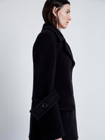 Proenza Schouler Detail image of model wearing Rowen Coat in Eco Double Face Wool in BLACK