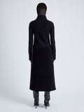 Proenza Schouler Back full length image of model wearing Aida Skirt in Brushed Melange Wool in CHARCOAL MELANGE