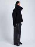 Side full length image of model wearing Adriana Skirt In Nappa in Black