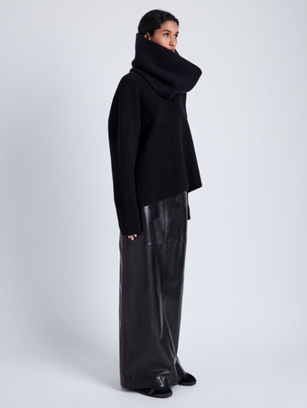 Proenza Schouler Side full length image of model wearing Adriana Skirt in Paper Leather in BLACK