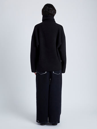 Back full length image of model wearing Yara Sweater In Double Face Cashmere in Black