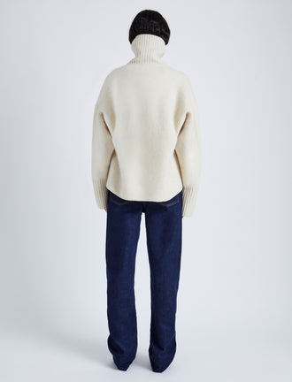 Proenza Schouler back image of model wearing Sandra Turtlneck Sweater in Lofty Eco Cashmere in ECRU