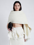 Front cropped image of model wearing Blanket In Textured Boucle Knit in Ivory
