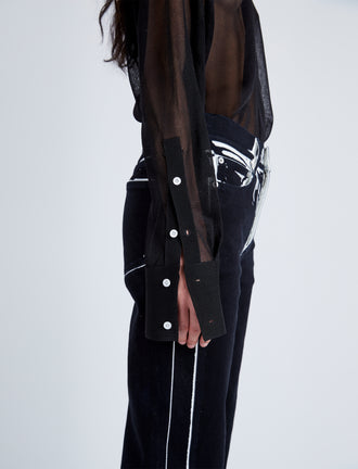 Detail image of model wearing Ryman Jean in black multi