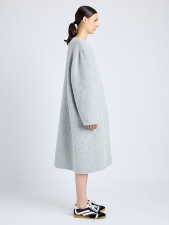 Proenza Schouler Side full length image of model wearing Albers Coat in Textured Double Face Wool in LIGHT GREY MULTI