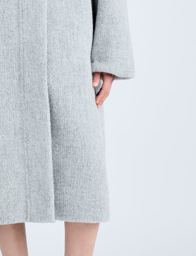 Proenza Schouler Detail image of model wearing Albers Coat in Textured Double Face Wool in LIGHT GREY MULTI