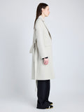 Proenza Schouler Side full length image of model wearing Thea Coat in Wool Gabardine Suiting in TAUPE