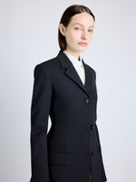 Proenza Schouler Detail image of model wearing Lark Blazer in Wool Gabardine Suiting in BLACK