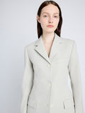 Proenza Schouler Detail image of model wearing Lark Blazer in Wool Gabardine Suiting in TAUPE