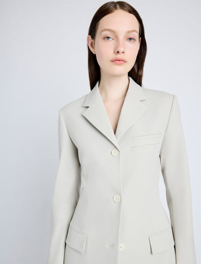 Proenza Schouler Detail image of model wearing Lark Blazer in Wool Gabardine Suiting in TAUPE