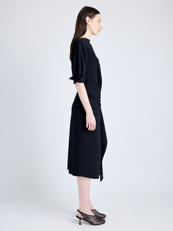 Proenza Schouler Side full length image of model wearing Maisie Dress in Matte Viscose Crepe in BLACK