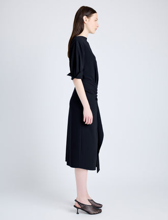 Proenza Schouler Side full length image of model wearing Maisie Dress in Matte Viscose Crepe in BLACK