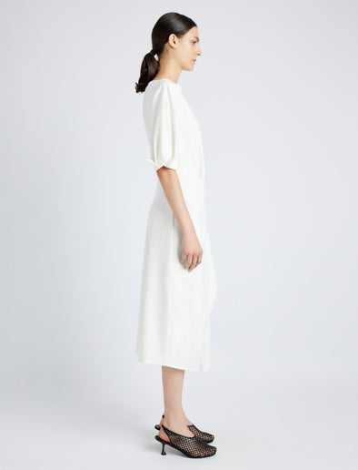 Proenza Schouler Side full length image of model wearing Maisie Dress in Matte Viscose Crepe in IVORY
