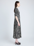 Proenza Schouler Side full length image of model wearing Harlow Dress in Printed Viscose Crepe in BLACK MULTI
