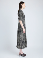 Proenza Schouler Side full length image of model wearing Harlow Dress in Printed Viscose Crepe in BLACK MULTI