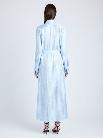 Proenza Schouler Back full length image of model wearing Hannah Dress in Stripe Silk Twill in PALE BLUE MULTI