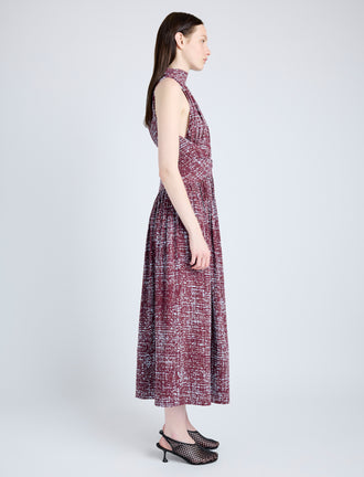 Proenza Schouler Side full length image of model wearing Lola Dress in Printed Viscose Crepe in OXBLOOD MULTI