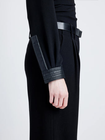 Proenza Schouler Detail image of model wearing Alexis Top in Matte Viscose Crepe with Faux Leathe in BLACK