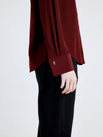 Proenza Schouler detail image of model wearing Arabella Top in Eco Silk in OX BLOOD