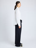Proenza Schouler Side full length image of model wearing Savannah Pant in Wool Gabardine Suiting in BLACK