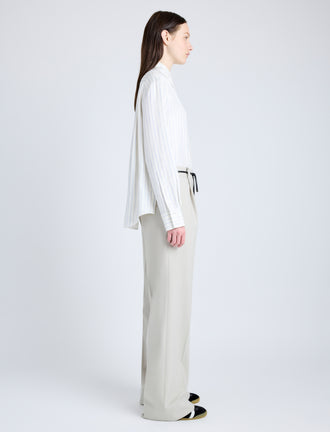 Proenza Schouler Side full length image of model wearing Savannah Pant in Wool Gabardine Suiting in TAUPE