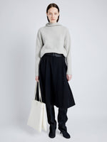 Proenza Schouler Front full length image of model wearing Greta Sweater in Lofty Eco Cashmere in LIGHT GREY MELANGE