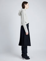 Proenza Schouler Side full length image of model wearing Greta Sweater in Lofty Eco Cashmere in LIGHT GREY MELANGE