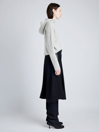 Proenza Schouler Side full length image of model wearing Greta Sweater in Lofty Eco Cashmere in LIGHT GREY MELANGE