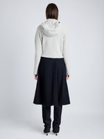 Proenza Schouler Back full length image of model wearing Greta Sweater in Lofty Eco Cashmere in LIGHT GREY MELANGE
