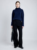 Proenza Schouler Front full length image of model wearing Greta Sweater in Lofty Eco Cashmere in NAVY